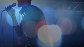 male and female singers performing on concert stage with bokeh lights, showing soundwave bars. Performance, musician, entertainment, atmosphere, stagecraft, dynamic, spotlight - Powered by Shutterstock - Get 15% off with code: PIKWIZARD15