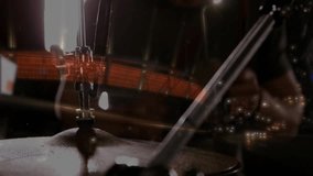 Male drummer playing behind cymbal stand in music studio, showcasing red LED streaks and LED panels. Musician, performance, stage, lighting, concert, energy, abstract - Powered by Shutterstock - Get 15% off with code: PIKWIZARD15