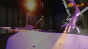 producer playing electronic keyboard on subway platform, with animated neon music notes flowing. Instrument, urban, vibrant, night, performance, artistic, nightlife - Powered by Shutterstock - Get 15% off with code: PIKWIZARD15