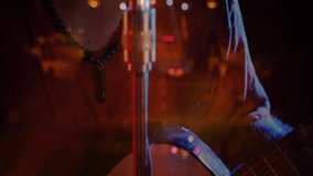 Male singer performing with retro microphone at music event, animating sound waves and bokeh lights. Vintage, performance, charisma, expressive, dramatic, neon, moody - Powered by Shutterstock - Get 15% off with code: PIKWIZARD15