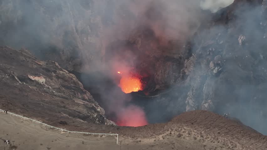 Small eruption of Mount Yasur Active Volcano in Vanuatu. Aerial over crater rim, nature wonder.