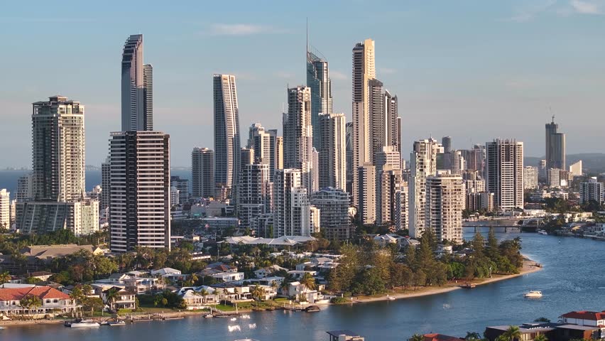 Skyscrapers and high rise buildings in Gold Coast city downtown, sunset light. Australia