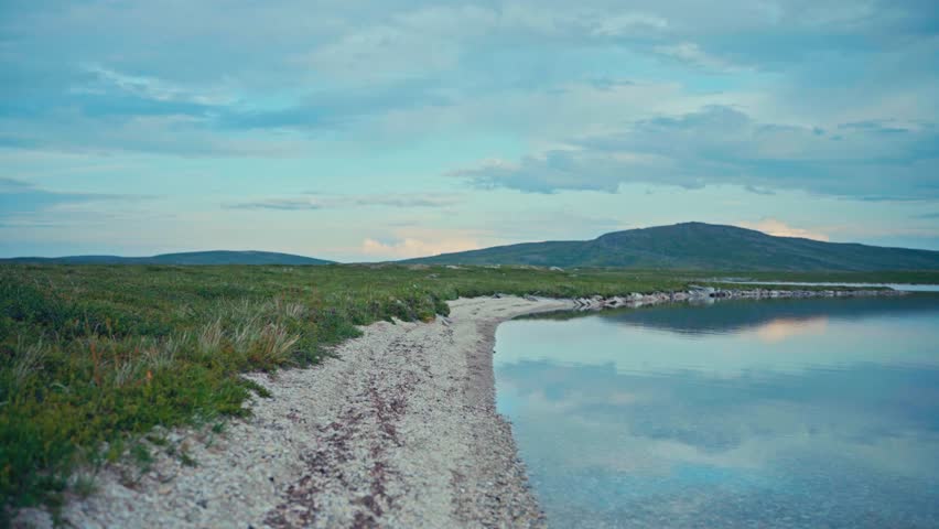 Peaceful Lake With Clouds Reflection At Sunset Near Kokelv Village In Norway. Wide Shot