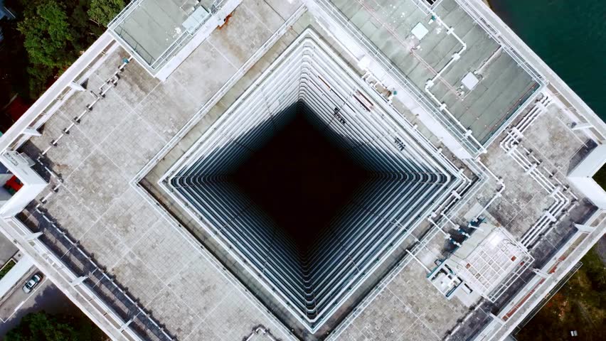 Aerial View of Building's Central Lightwell and Rooftop Architecture - Powered by Shutterstock - Get 15% off with code: PIKWIZARD15