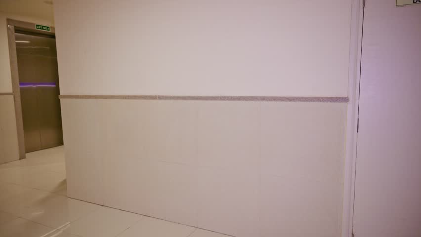 Bearded man heads toward unlocking doorway for executive, Assistant carrying headset and satchel swing gateway, Turbaned guy steps at gate with bosses luggage, Male open passageway to receive superior