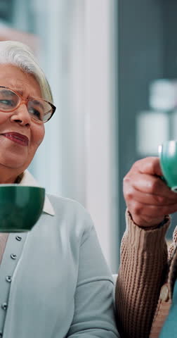 Home, cheers and old couple with coffee, smile and senior woman with hot beverage, drinking and lounge. House, toast and elderly people with tea in living room, relax and celebration for retirement