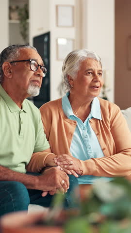 Senior, happy couple and listening with consultation for retirement, pension funding or agreement at home. Elderly, man and woman with smile on sofa for healthcare support or plan together at house