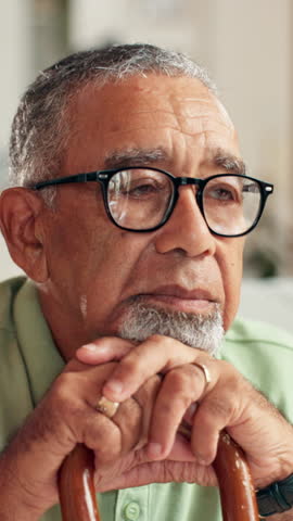 Senior man, sad and thinking with cane in retirement home for remember, loss or nostalgia with memory. Lonely, person or thoughtful face with walking stick for elderly grief, anxiety or mental health