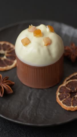Easter sweet cake covered with icing with fruit and candied fruits. Sweets for the table of the religious feast of Easter
