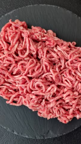 Ground beef mince fresh raw with salt and spices. Ground beef is an ingredient for making burger patties