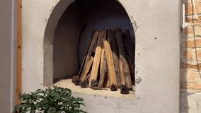 Firewood and fir cones Chopped birch firewood in brick niche under fireplace - Powered by Shutterstock - Get 15% off with code: PIKWIZARD15