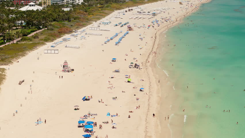 Aerial shot from above Miami beach, during bright sunny summer day 