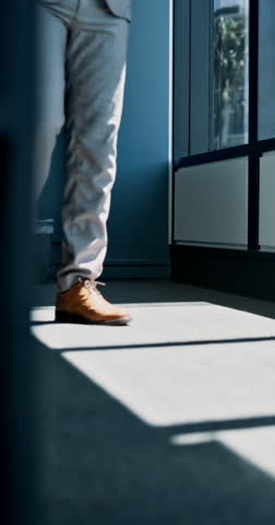 Legs, business person and walking in office for arrival in corporate workplace for professional opportunity. Shoes, employee and feet of worker in company hallway for commute with formal footwear