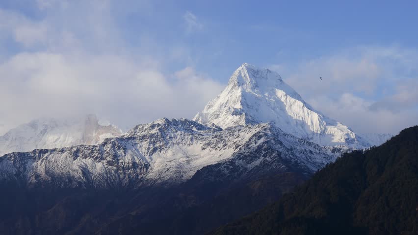 Annapurna South mountain summit in Himalaya mountain range in Nepal. Nepal Himalayas mountains beautiful landscape from Annapurna Base Camp trek. Hiking in the mountains scenic views of Annapurna