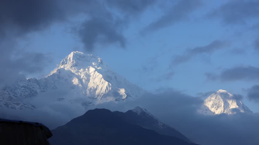 Annapurna South mountain summit in Himalaya mountain range in Nepal. Nepal Himalayas mountains beautiful landscape from Annapurna Base Camp trek. Hiking mountains scenic views of Annapurna timelapse