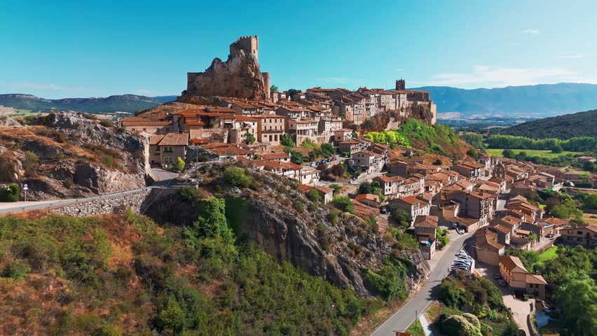 Aerial view of the medieval village of Frias, Burgos, Castilla Leon, northern Spain. Picturesque stone village with a historic castle, surrounded by scenic rural landscape