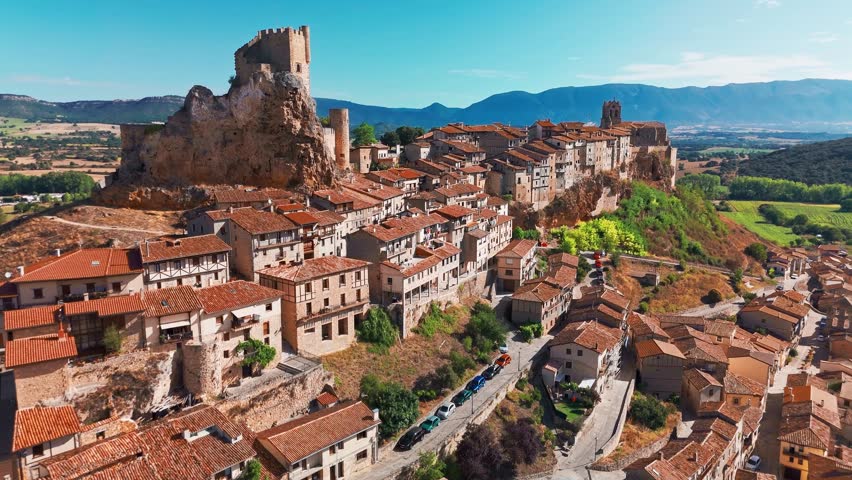Aerial view of the medieval village of Frias, Burgos, Castilla Leon, northern Spain. Picturesque stone village with a historic castle, surrounded by scenic rural landscape