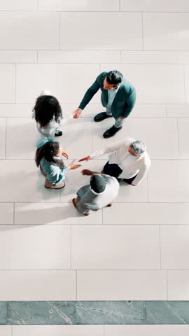 Handshake, above and meeting with business people at conference for introduction, partnership and welcome. Thank you, networking event and shaking hands with group of employees for b2b forum