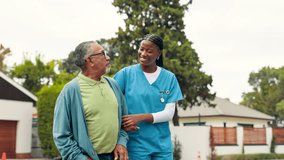 Walking, nurse and old man with smile, conversation and help with support, healthcare and assist. Outdoor, medical and caregiver with senior patient, laughing and morning with discussion and wellness - Powered by Shutterstock - Get 15% off with code: PIKWIZARD15