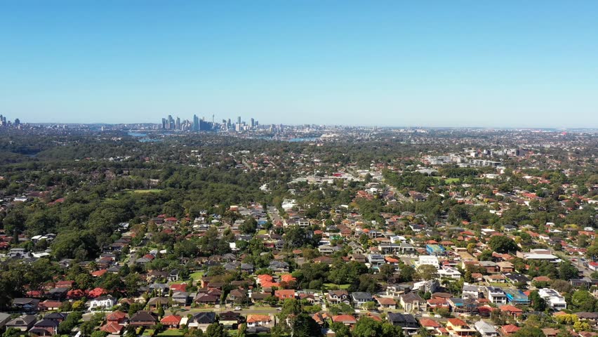 Long aerial panning in Greater Sydney of Australia over City of Ryde suburbs as 4k.
