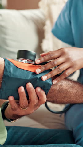 Blood pressure, sofa and hands of nurse with patient for medical service, exam and consulting. Healthcare, retirement or caregiver and elderly man with pump for cardiology, heart rate or hypertension