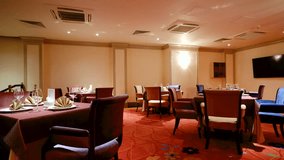 Elegantly made empty dinner tables in a chic restaurant shot with a slider - Powered by Shutterstock - Get 15% off with code: PIKWIZARD15