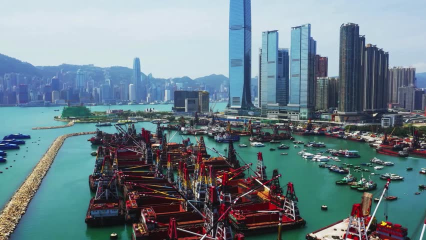 Hong Kong Harbor Aerial View: Skyscrapers, Container Port, and Boats