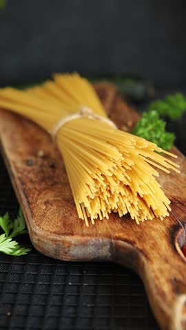 Spaghetti raw pasta durum wheat natural food fresh dish on the table rustic food top view copy space