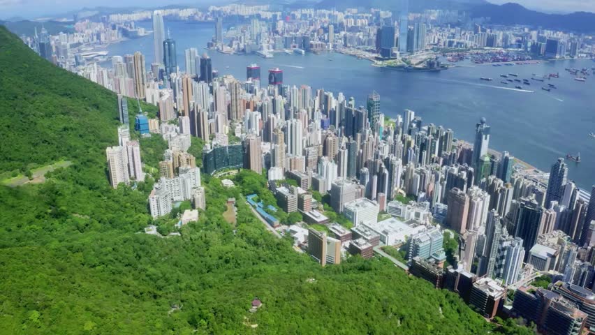 Aerial View of Hong Kong Cityscape and Lush Green Hills
