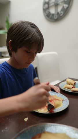 A Happy Child Enjoying a Meal at Home Delicious Pancakes and Tasty Treats Galore