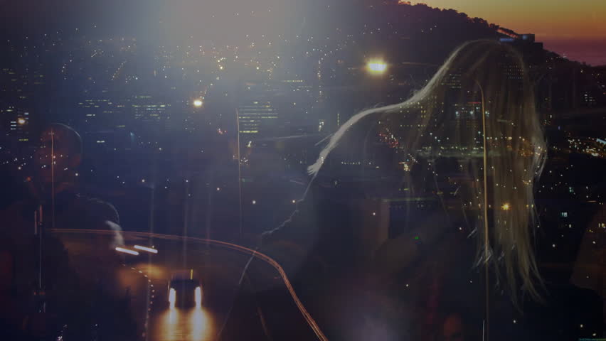 music duo singing in dim-lit studio at night, showing vintage mic against cityscape reflections. Urban, nightlife, performance, ambience, artistry, vibrant, creative