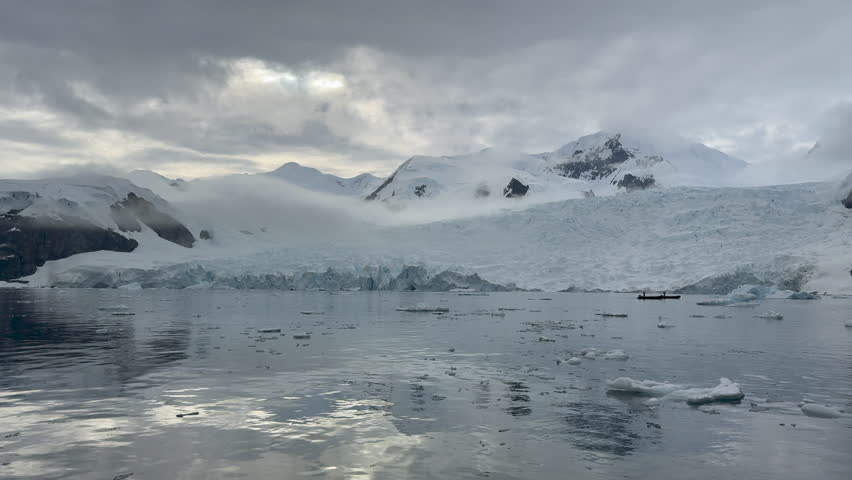 Big Iceberg in Antarctica Winter Scenery, Amazing Shape Ice Formation of Massive Large Enormous Blue Icebergs in Antarctic Peninsula Landscape Seascape with Ocean Sea Water