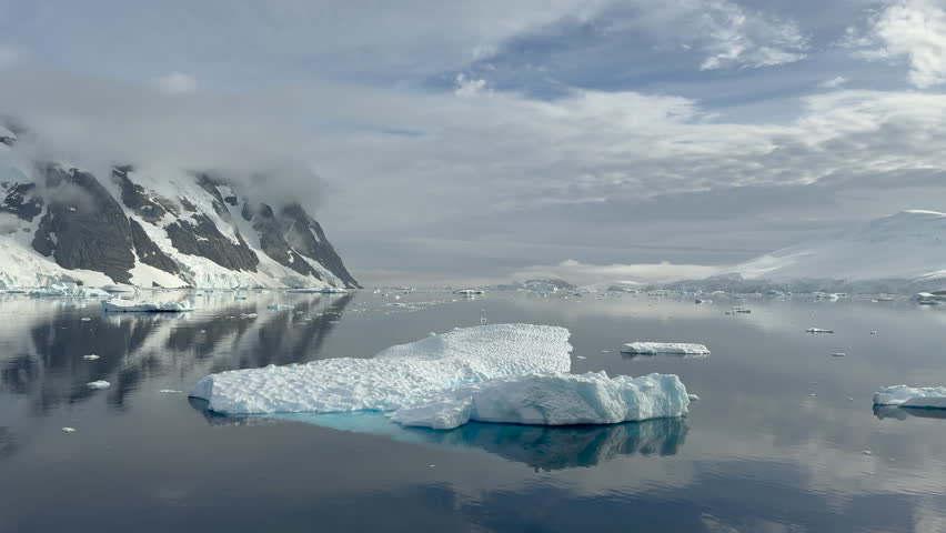 Big Iceberg in Antarctica Winter Scenery, Amazing Shape Ice Formation of Massive Large Enormous Blue Icebergs in Antarctic Peninsula Landscape Seascape with Ocean Sea Water