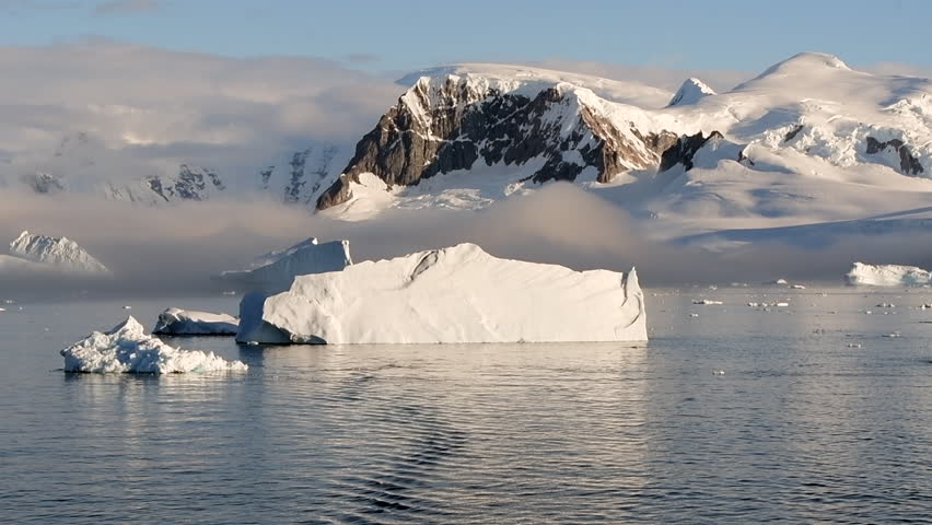 Big Iceberg in Antarctica Winter Scenery, Amazing Shape Ice Formation of Massive Large Enormous Blue Icebergs in Antarctic Peninsula Landscape Seascape with Ocean Sea Water