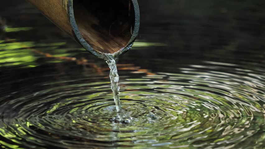 5x slow-motion video of water falling from a bamboo tube