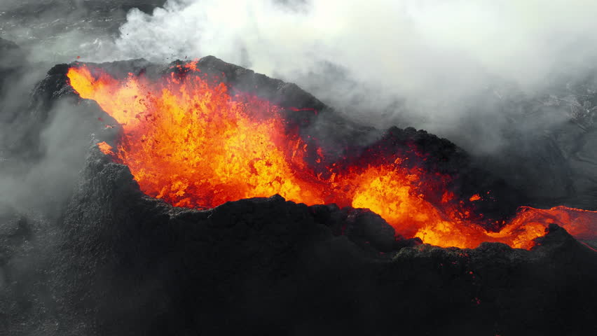 Volcano Eruption, Flowing Red Hot Lava Erupts from Crater, Incredible Natural Phenomena, Spectacular Dramatic Scenery in Iceland