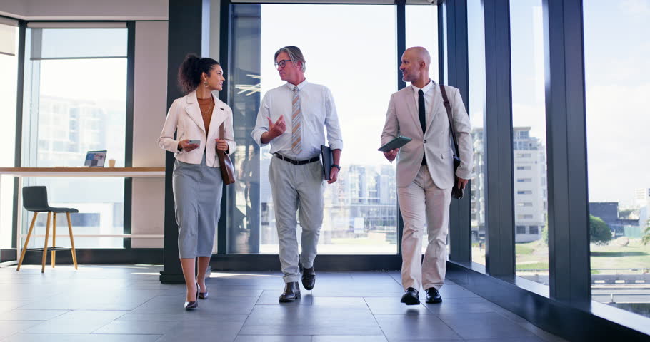 Walking, man and woman as confident realtor In office for meeting or consulting in company. Happy people, employee and pride as real estate agent in property management, development and town planning