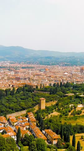 Vertical video. Florence, Italy. Cathedral Santa Maria del Fiore. Panoramic view of the city. Summer, Aerial View, Departure of the camera. Rich colors