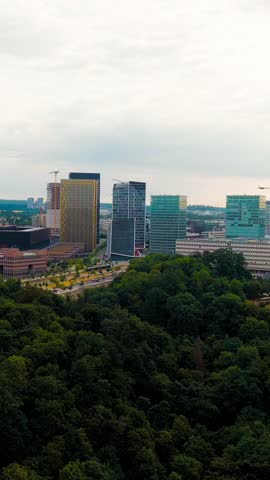 Vertical video. Luxembourg City, Luxembourg. View of the Kirchberg area with modern houses, Aerial View. Rich colors