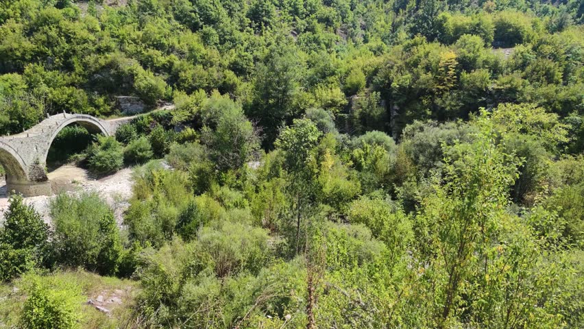 Amazing  view of Medieval Plakidas (Kalogeriko) Bridge at Pindus Mountains, Zagori, Epirus, Greece
