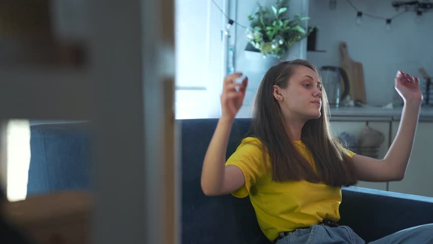 Happy family concept. young girl resting on sofa at home. relaxing on day off. relaxation at home on the sofa. emotions of calm and satisfaction. the girl is resting and dreaming. stretching on sofa