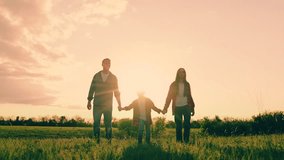 Father, daughter son playing on natural grass meadow enjoy freedom together. Parent children boy girl playing in meadow. Happy family running flying holding hands at sunset sunny field slow motion. - Powered by Shutterstock - Get 15% off with code: PIKWIZARD15