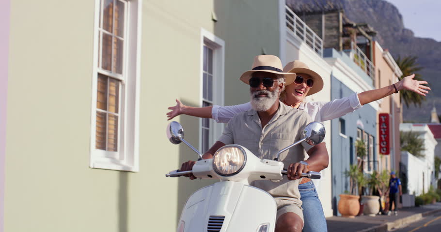 Couple, scooter and freedom for travel, holiday and fun adventure or riding in city road with sunglasses. Man, motorbike and woman for summer trip, vacation and journey with shades in Havana Cuba