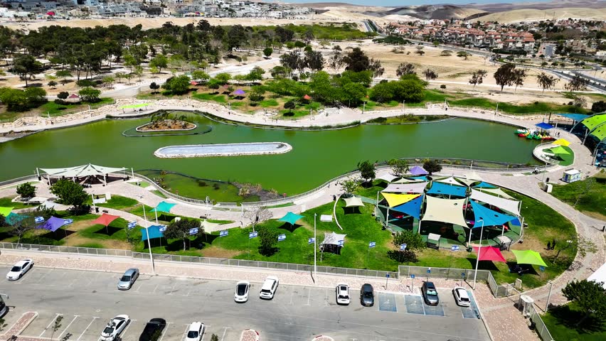 Drone Aerial View of Public Park and Lake in Dimona, Israel - Desert City Landscape