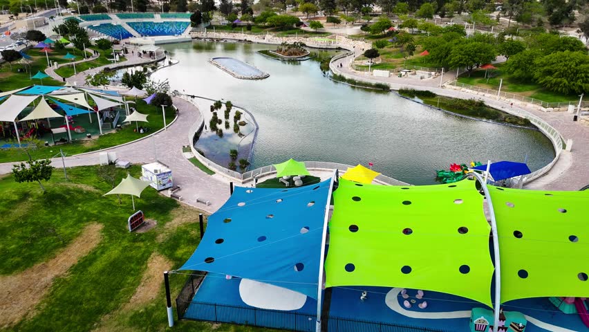 Drone Aerial View of Public Park and Lake in Dimona, Israel - Desert City Landscape