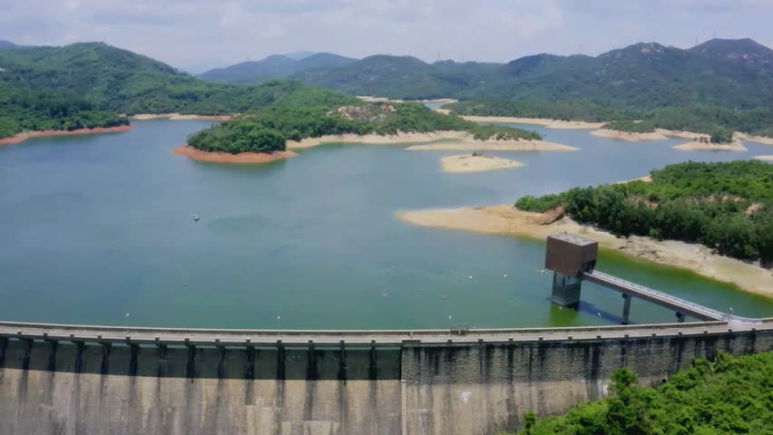 Serene Reservoir Landscape with Dam and Hilly Terrain