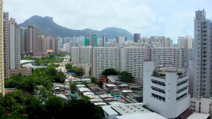 Hong Kong Dense Urban Landscape with Mountains in Background
