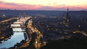 ROUEN, NORMANDY, FRANCE: timelapse and aerial view of historic city center at sunset with Cathedral and bridges over Seine river, from viewpoint "Cote Sainte-Catherine" - Powered by Shutterstock - Get 15% off with code: PIKWIZARD15
