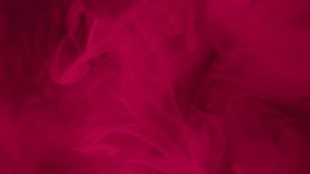 Mystical paint. Magenta flow. Foggy colored blur on dark abstract background. Ink smoky dissolves in water mixing with small pink particles liquid. - Powered by Shutterstock - Get 15% off with code: PIKWIZARD15