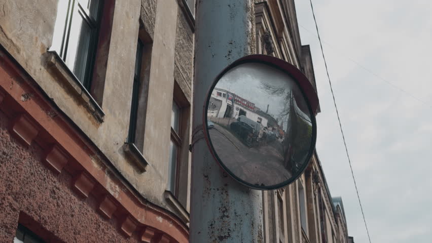 Urban Reflection A Stunning Street Scene Captured in a City Mirror 4K RealTime HighQuality Footage